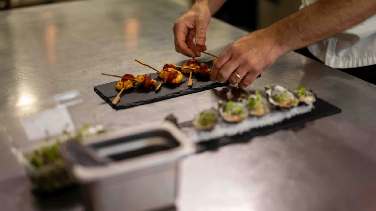 Chef serving canape dishes