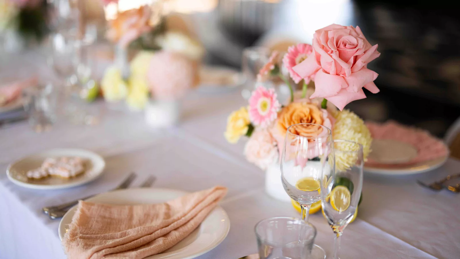 Flowers and linen on table with glassware