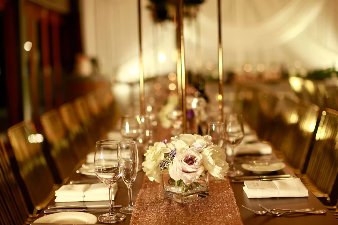 Long table set for a wedding with flowers and decorations