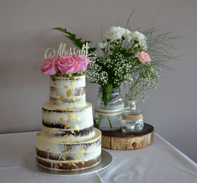 Three tier wedding cake decorated with flowers
