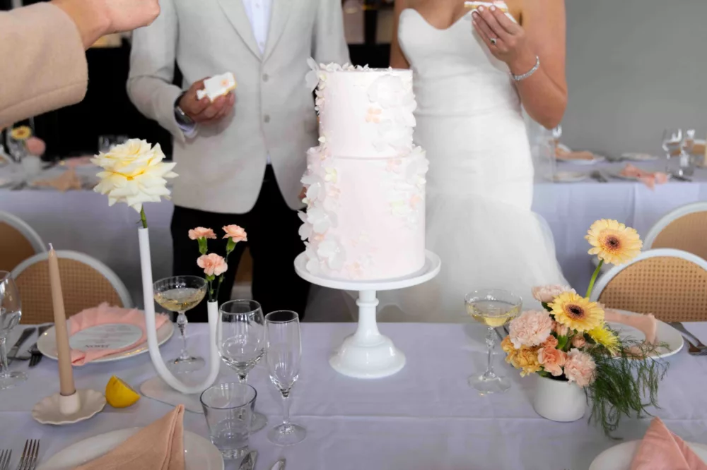 Wedding couple cutting wedding cake