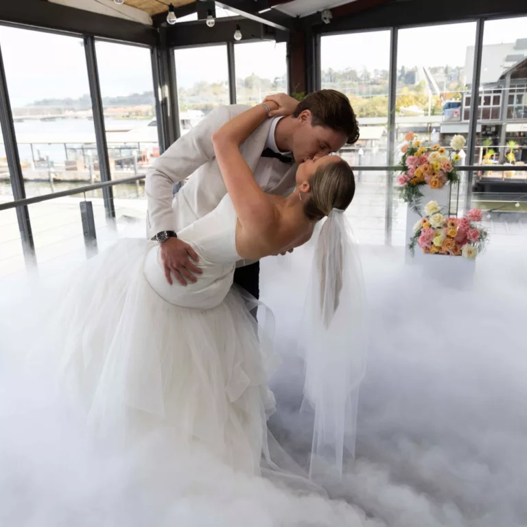 Wedding couple during their first dance with smoke machine