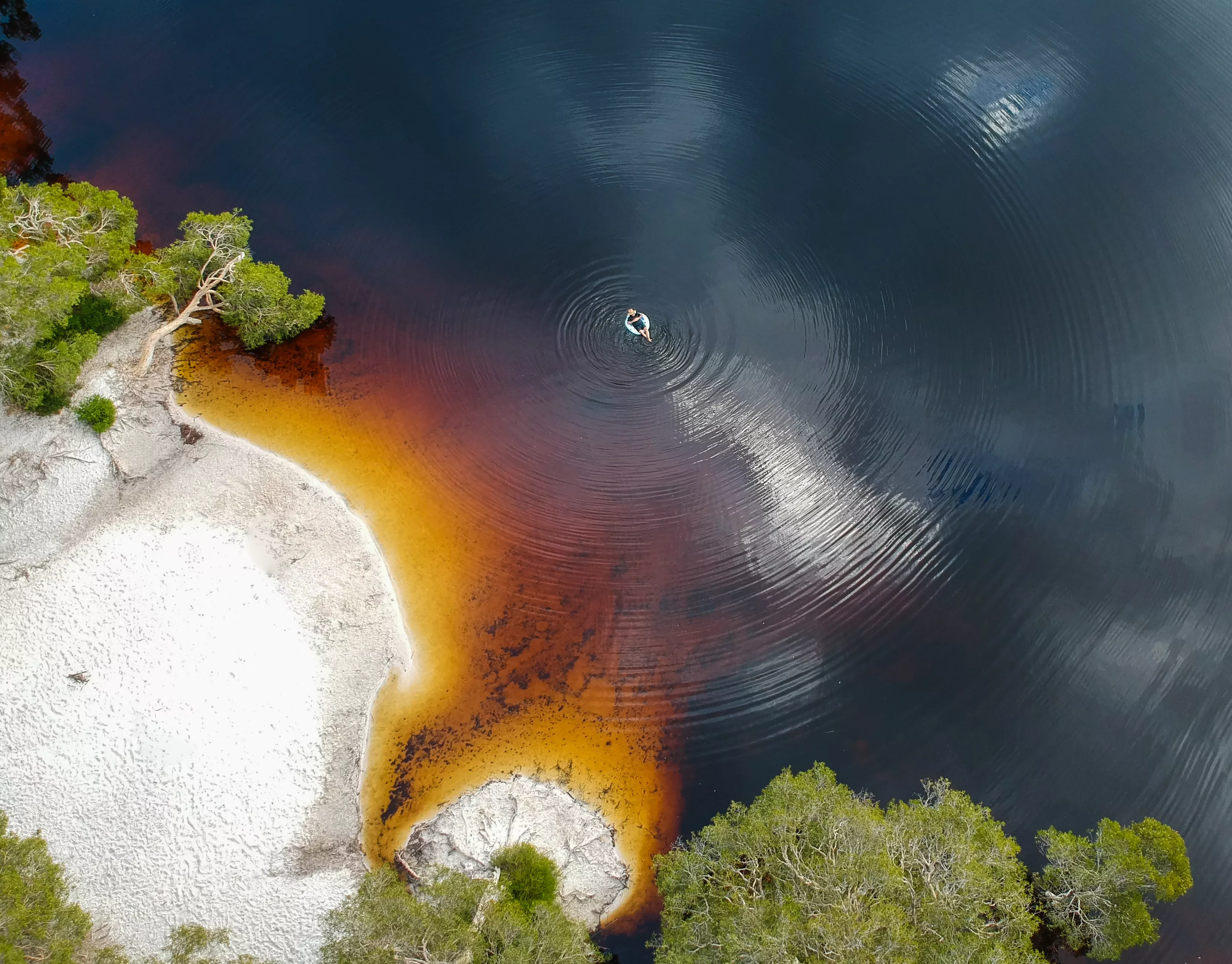 Discover North Stradbroke’s Brown Lake, where serene waters meet colour.