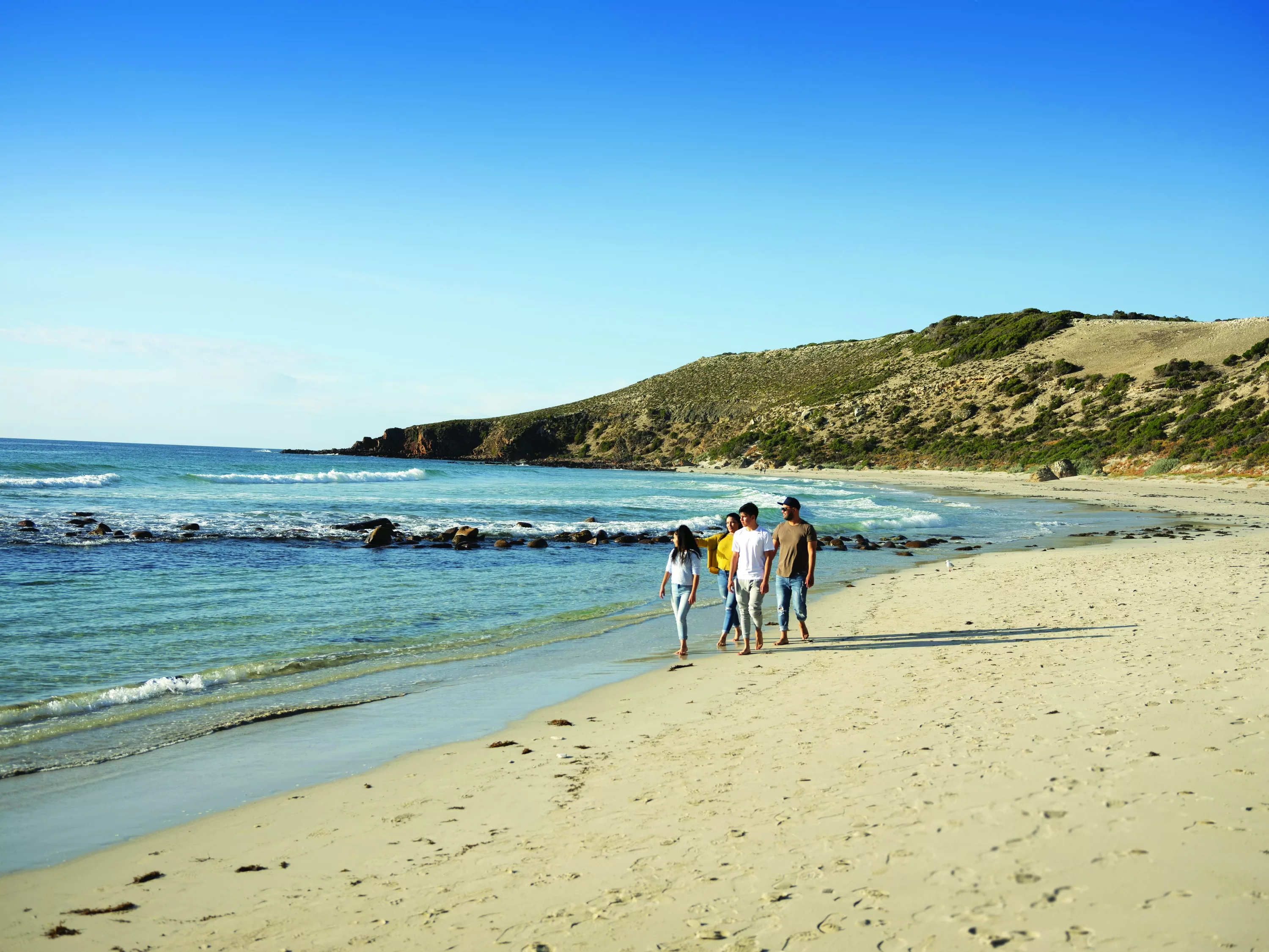 stokes-bay-family-walking-on-beach