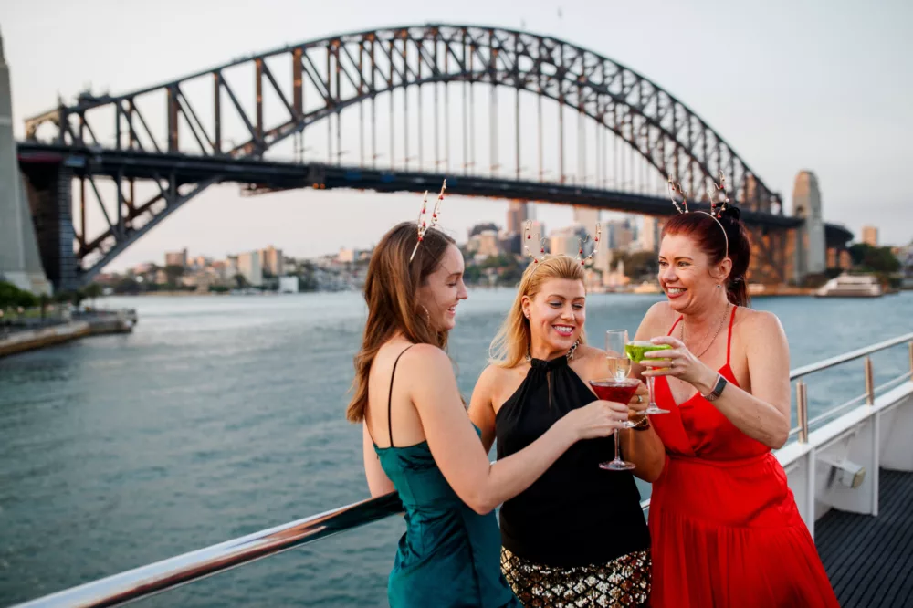 Smart casual group of charter girls celebrating Christmas special events with Harbour Bridge in the background