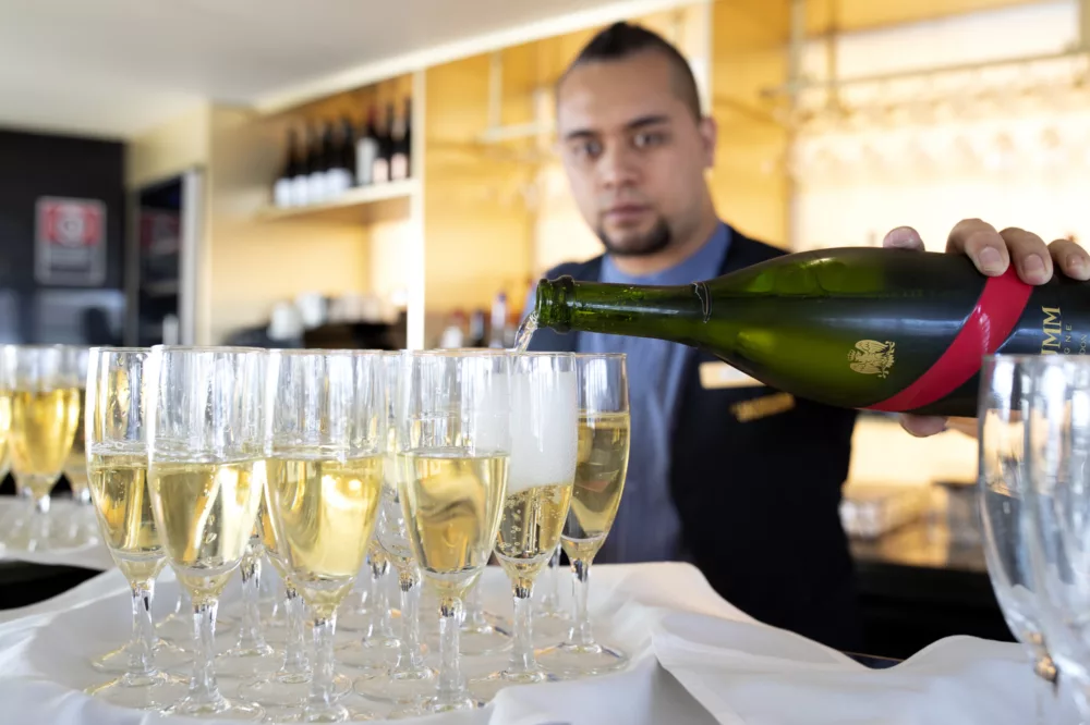 JX The Jackson waiter pouring Mumm champagne - 05May22