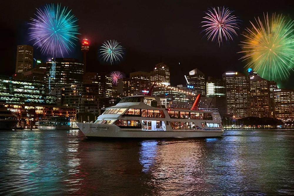 John Cadman 2 JC2 boat at night with fireworks in the background NYE doctored