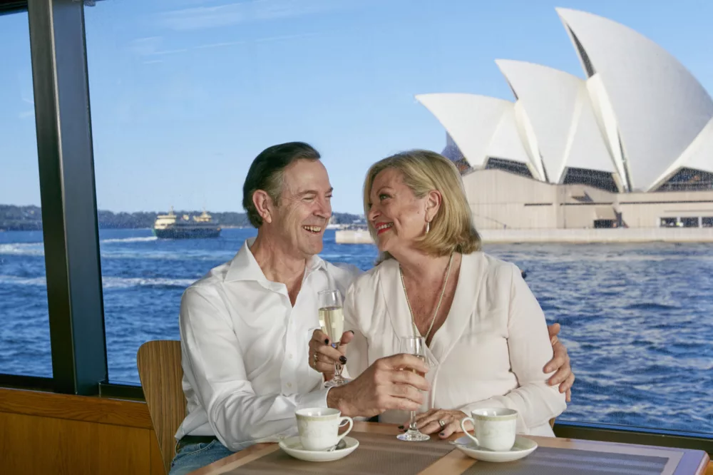 Premium sightseeing senior couple enjoying champagne and tea Harbour Experience, BB
