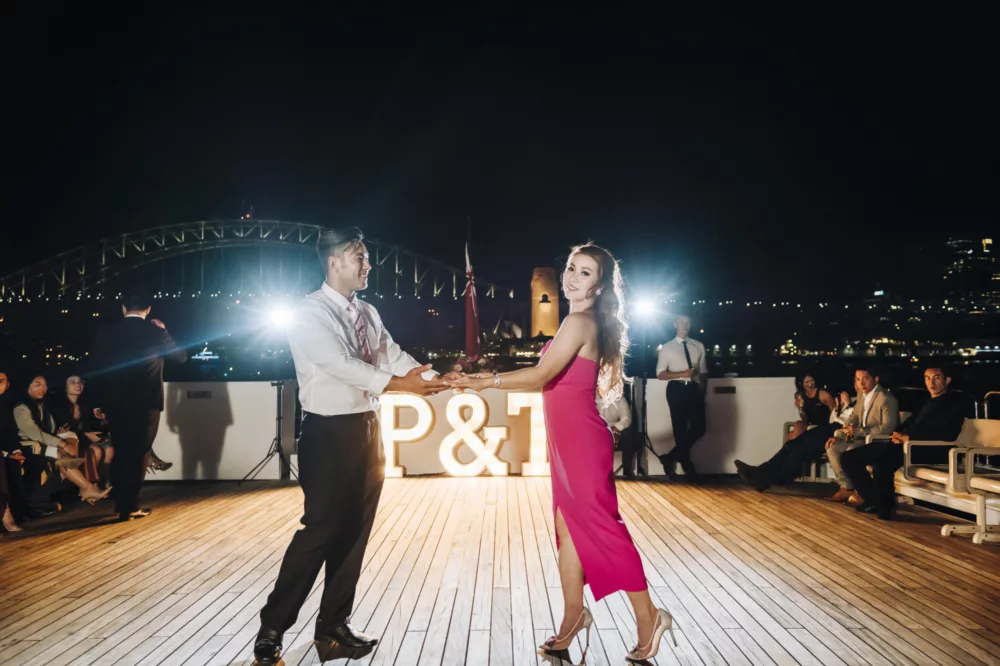Wedding night groom and bride dancing onboard open deck of Captain Cook 3 gala event special occasion charters