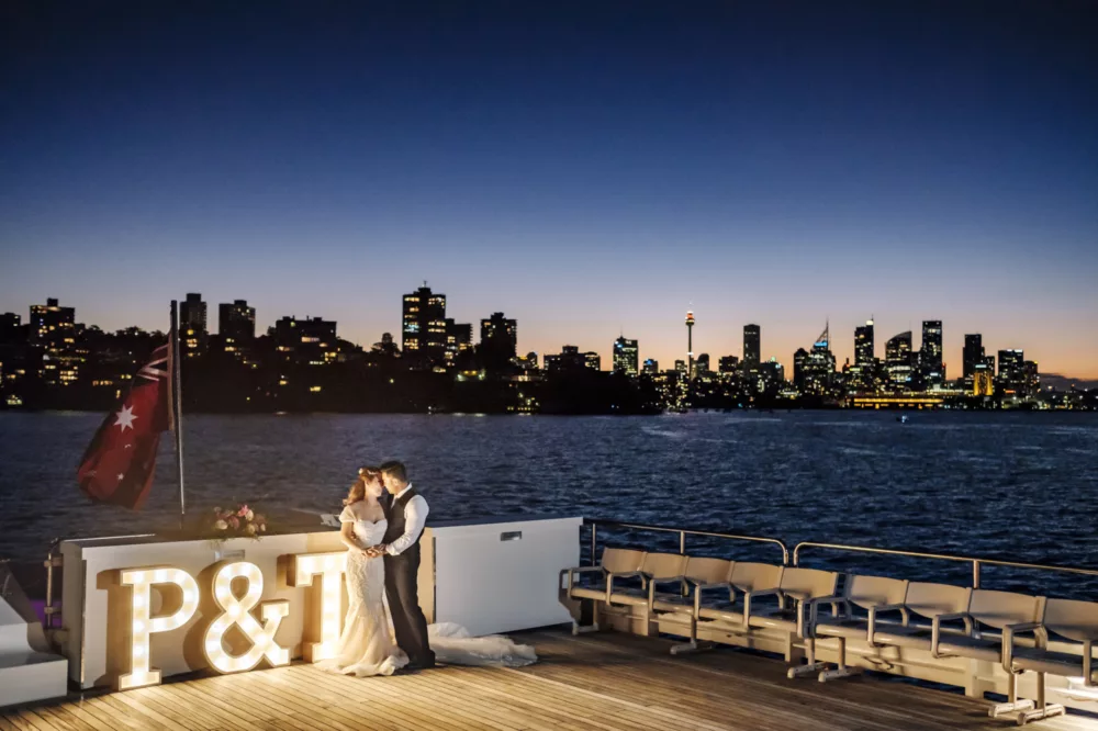 Wedding day panoramic shot during sunset with city skyline in the background charters fleet Captain Cook 3 special occasions