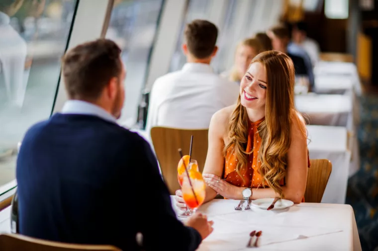 Couple having cocktail drink during Top Deck Lunch day time