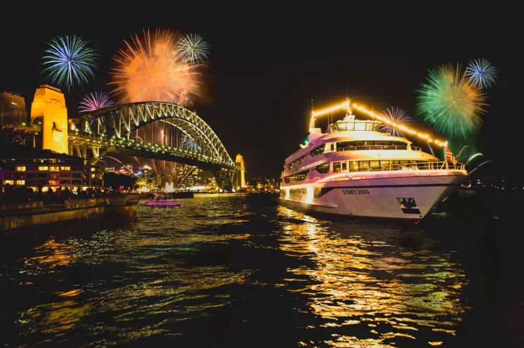Sydney 2000 boat coming into Circular Quay with fireworks in the background at night NYE New Years Eve special events