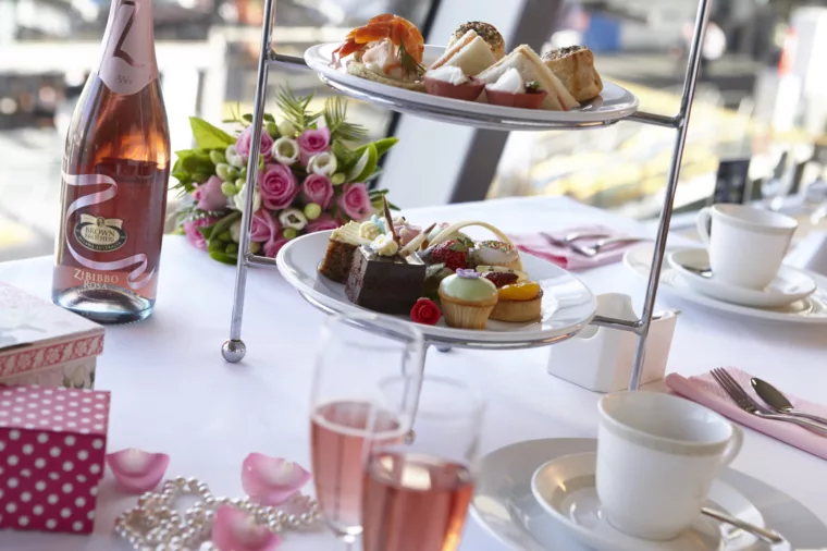 High Tea at Sea premium dining tiered food plates with pink champagne glasses