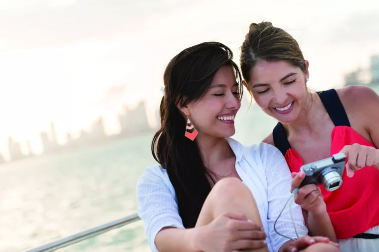 Girls Looking at Photo Camera