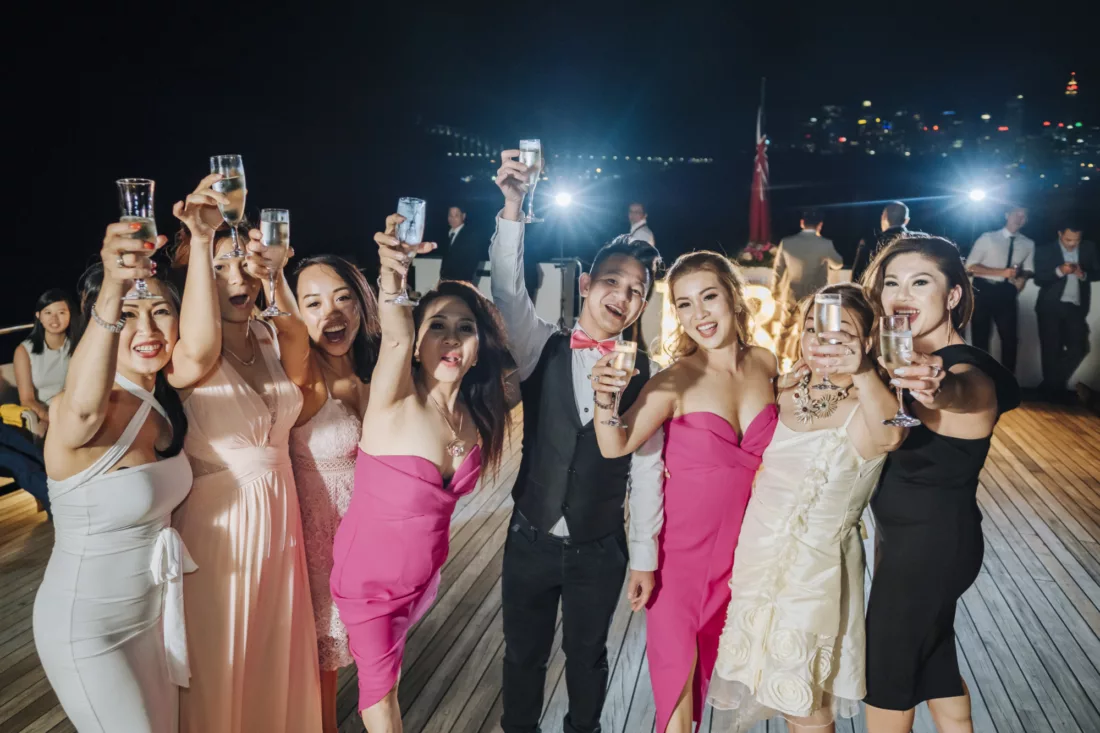 Wedding gala event group of friends toasting party at night special occasion charters