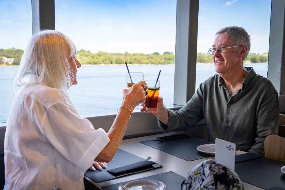 Elderly couple having lunch on the Swan River