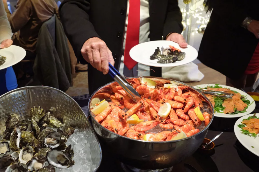 Dinner on the Christmas Dinner Cruise with fresh WA Oysters and Tiger Prawns.