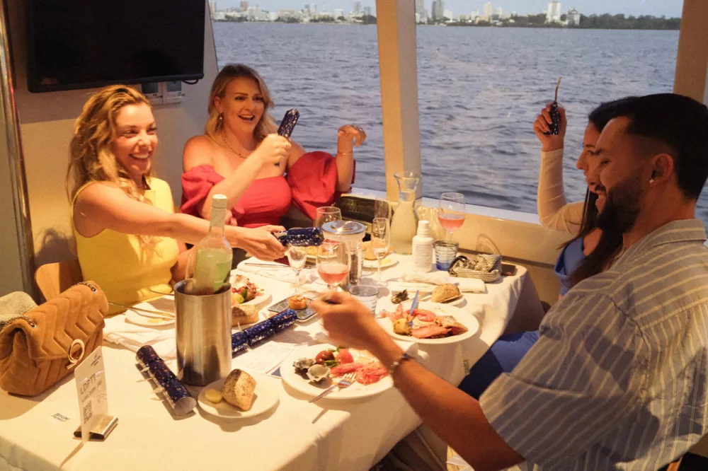 Cracking Christmas Crackers on the Chirstmas Dinner Cruise
