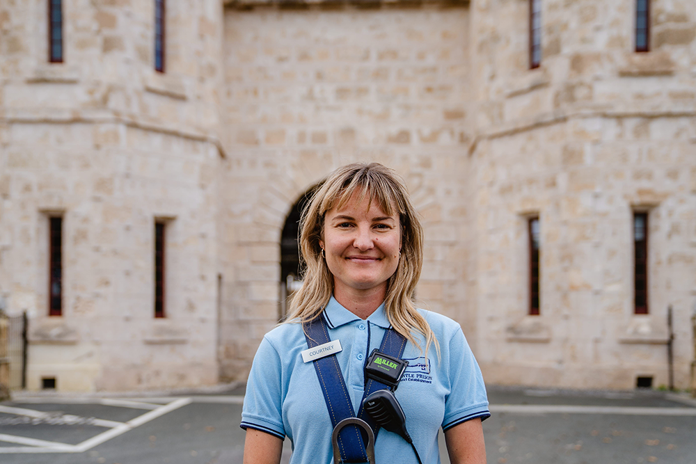 A female tour guide outside the Fremantle Prison