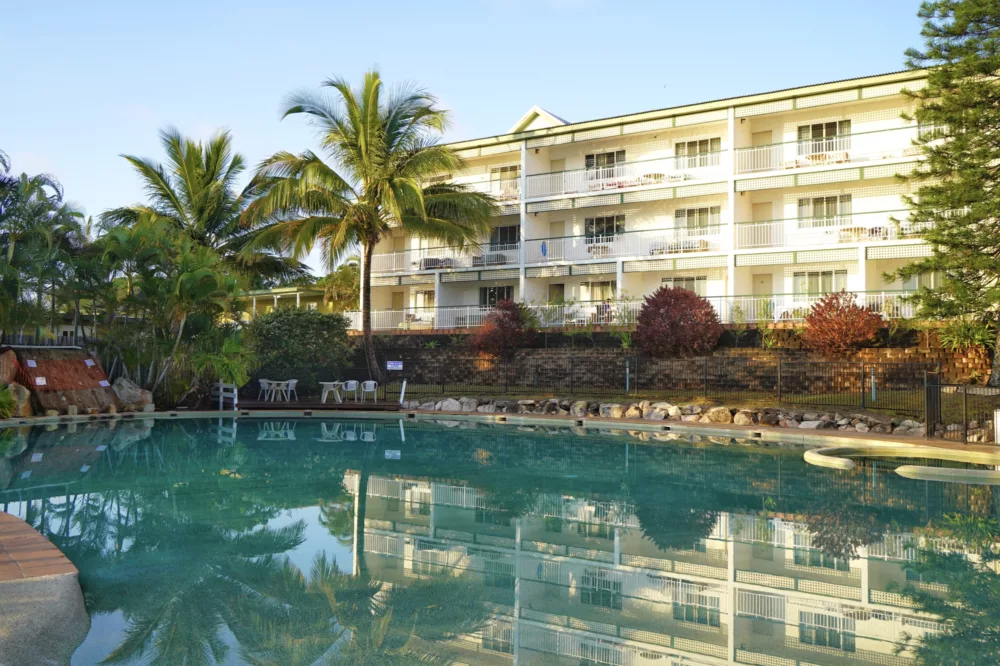 Pool with hotel rooms in background at K'gari Beach Resort, K'gari (Fraser Island)