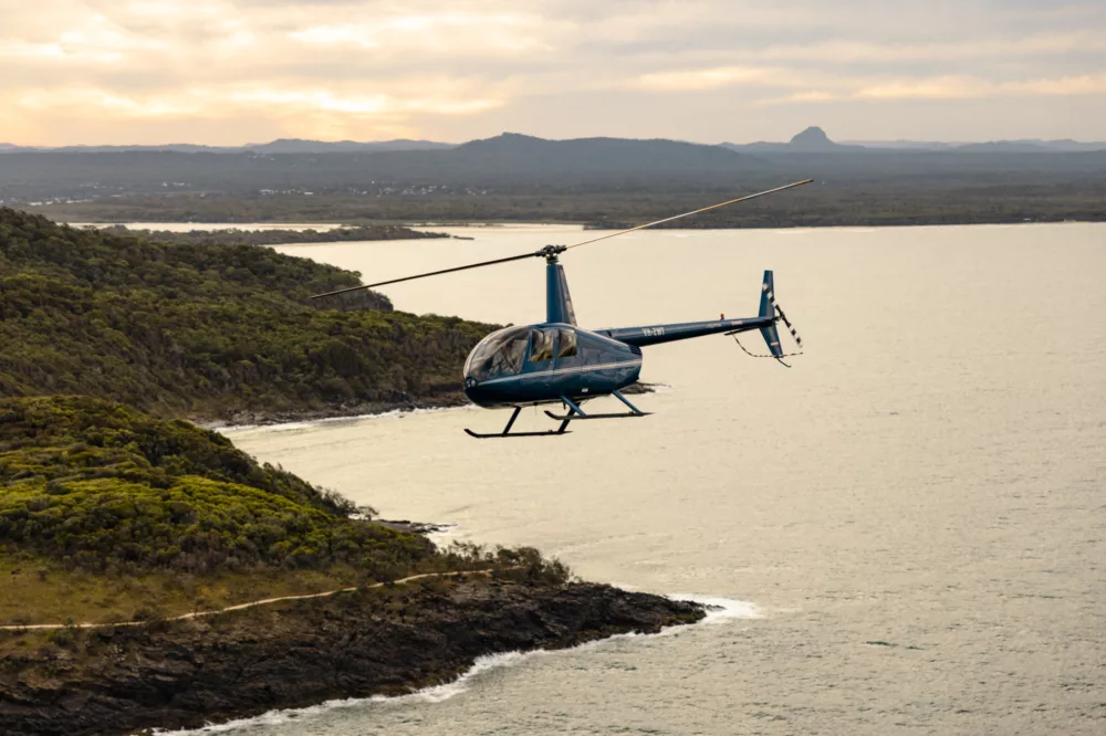 Helicopter flying over K'gari (Fraser Island)