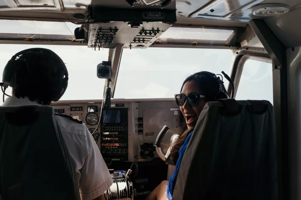 Pilot and girl in front seat of plane, K'gari (Fraser Island)