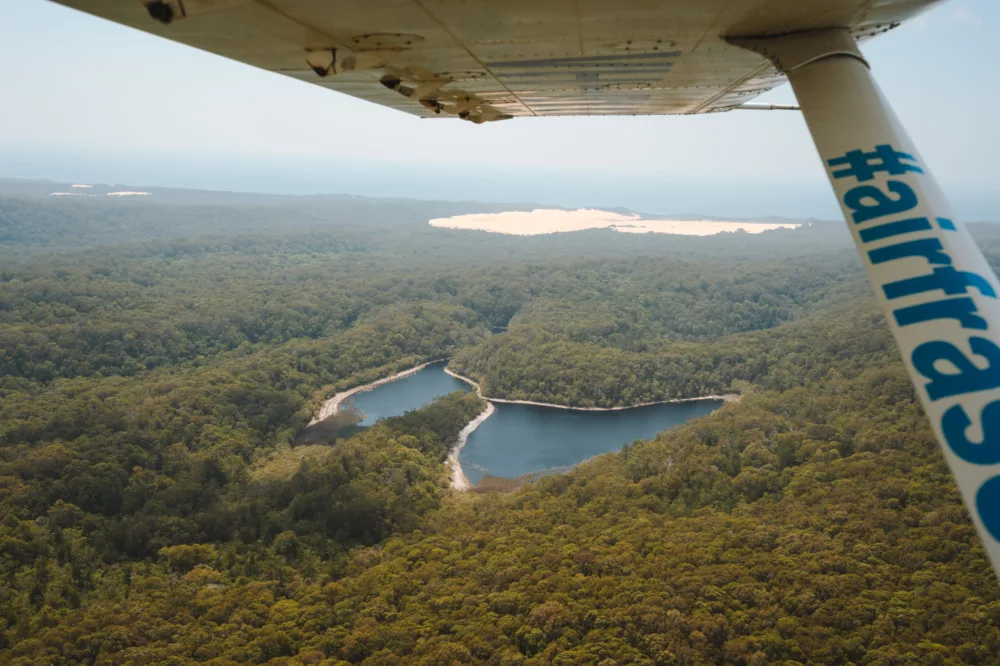 Air Fraser plane flying over Butterfly Lake, K'gari (Fraser Island)