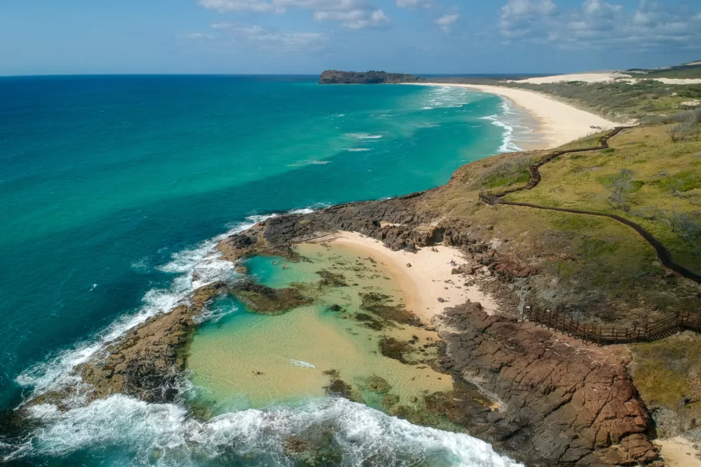 Aerial of Champagne Pools & Waddy Point in background, K'gari (Fraser Island)