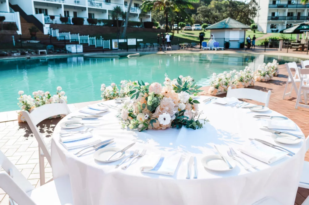 Wedding table decor by the pool at K'gari Beach Resort, K'gari (Fraser Island)