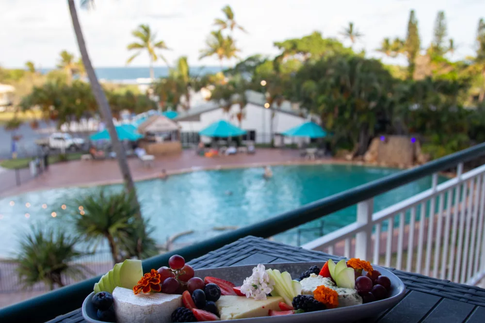 Cheese platter on balcony overlooking pool at K'gari Beach Resort, K'gari (Fraser Island)