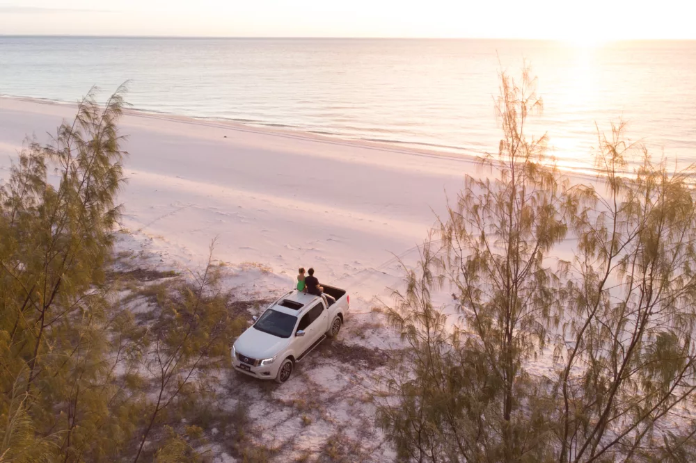 Couple watching the sunrise on K'gari (Fraser Island)