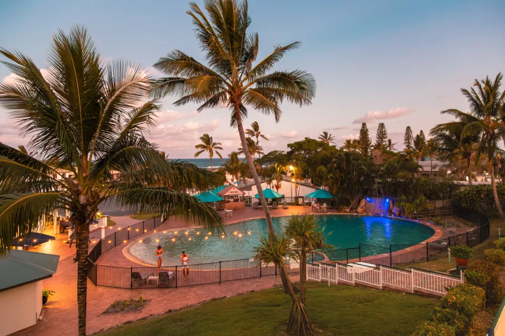 K'gari Beach Resort pool area at dusk