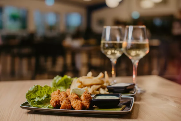 Wine glasses & dinner in McKenzie's on 75 Restaurant at K'gari Beach Resort, K'gari (Fraser Island)