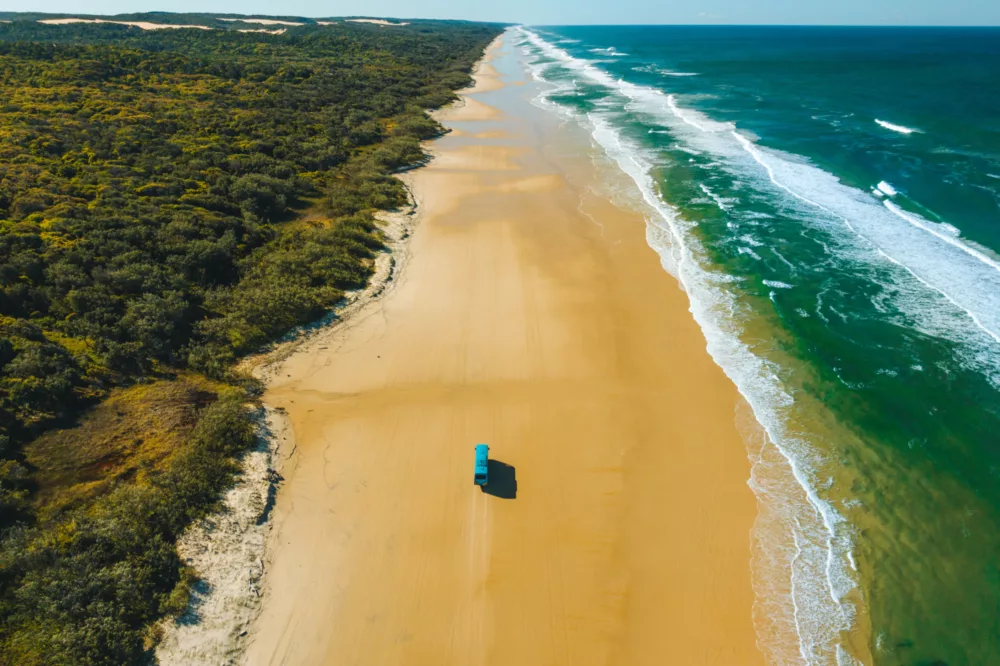 K'gari Explorer Tours coach on 75 Mile Beach K'gari Fraser Island