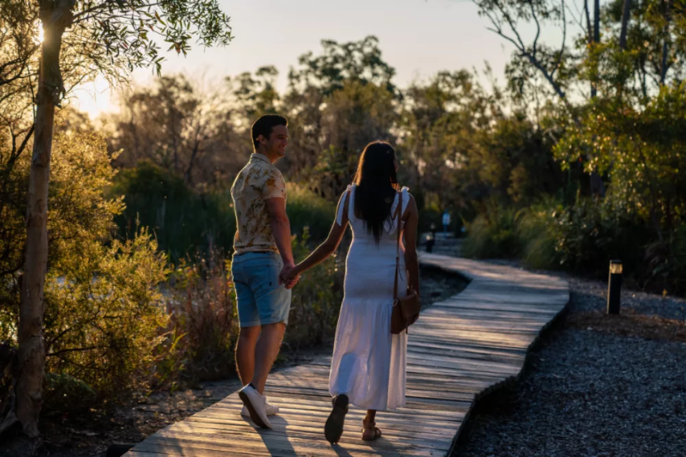 Couple walking thorugh wallum at Kingfisher Bay Resort