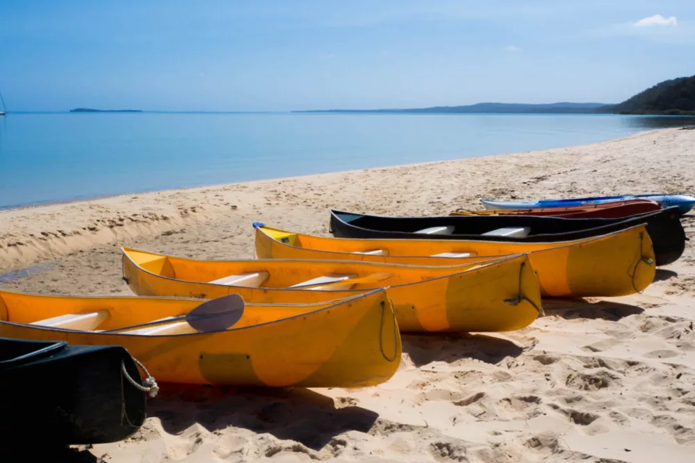 Canoes on the western beach at Kingfisher Bay Resort, K'gari (Fraser Island)