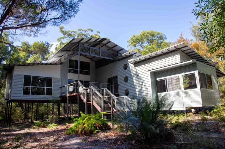 Stirling House exterior shot showing the house immersed in nature