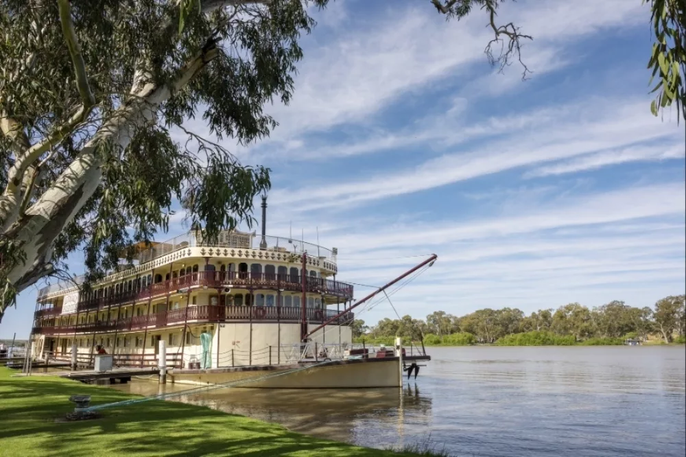 Vessel moored at rivers edge