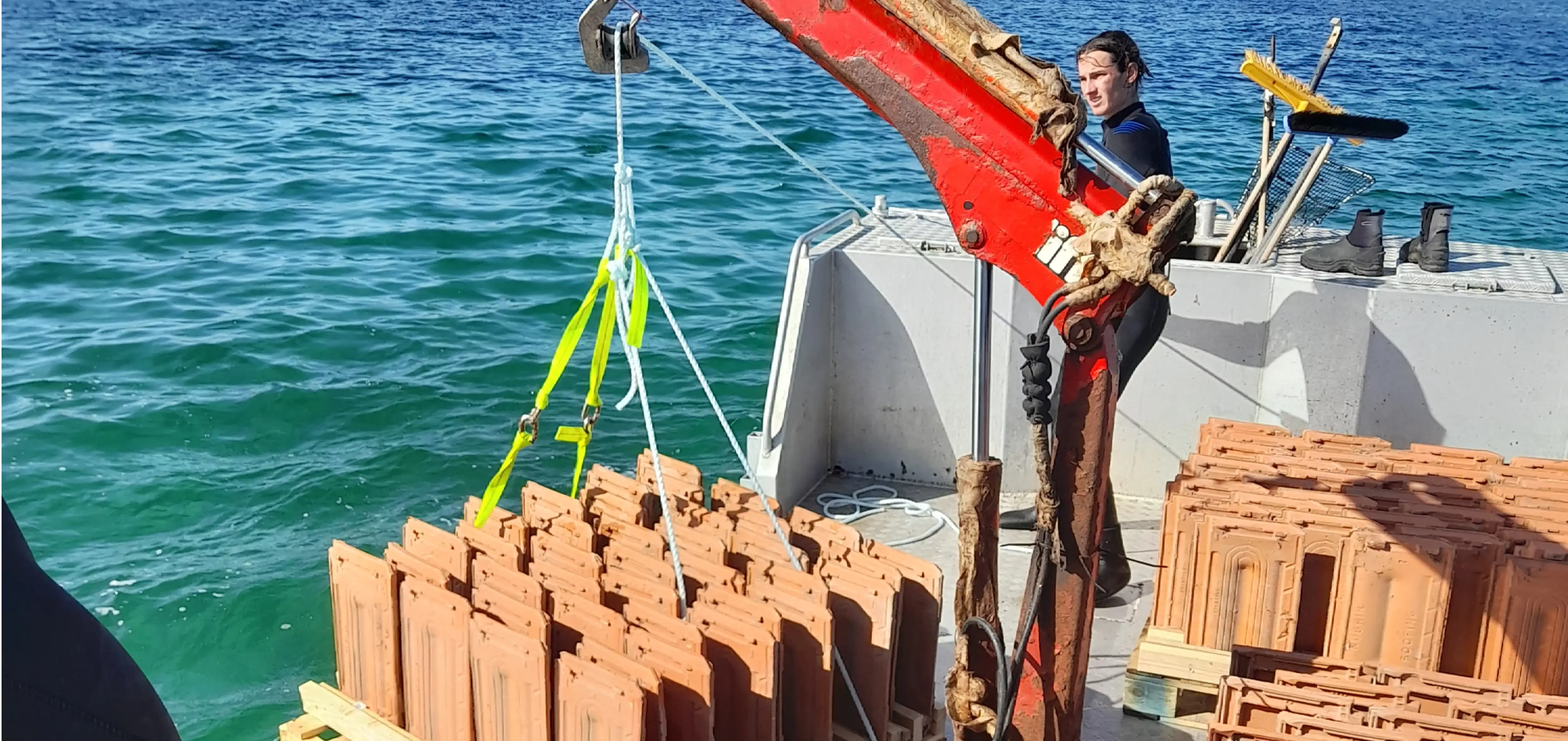 The KI Shellfish punt deploying terracotta tile modules at American River