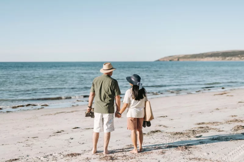 A couple enjoying the sun at Emu Bay on KI