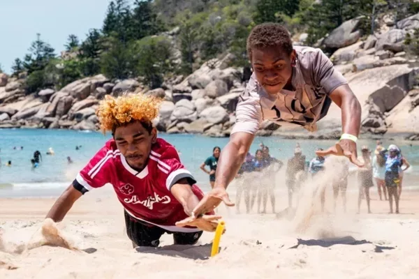 NRL Cowboys House - students diving for flag