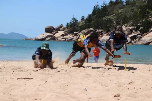 NRL Cowboys House Students diving for flags
