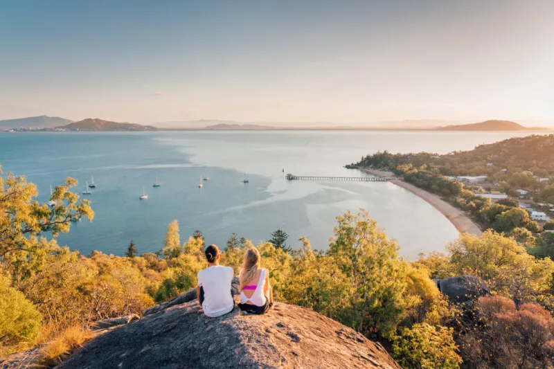Couple looking at Sunset from Hawkings Point Lookout