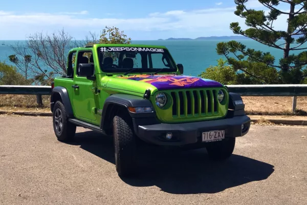 Image showcasing a green rental Jeep on Magnetic Island.