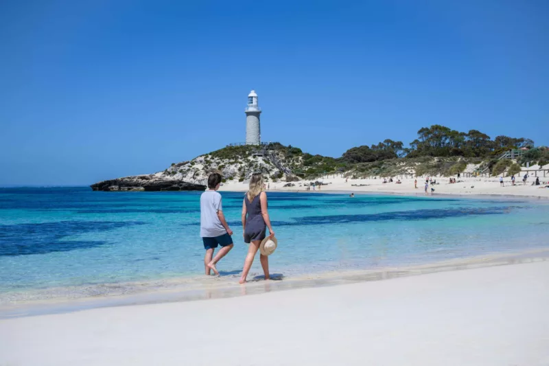 Friends walking along Piny Beach