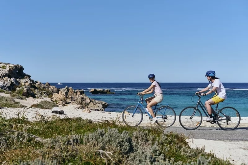 Couple riding bikes on Rottnest Island