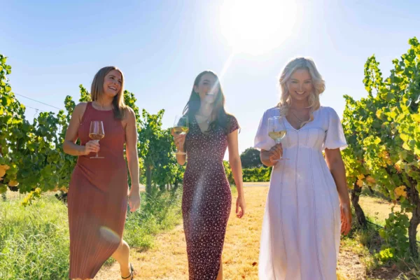 Ladies walking through vineyards in the Swan Valley