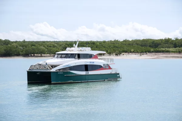 A white and  blue ferry in the sea