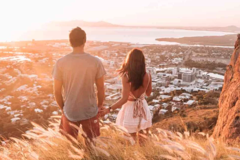 A couple enjoy the sunset over Townsville
