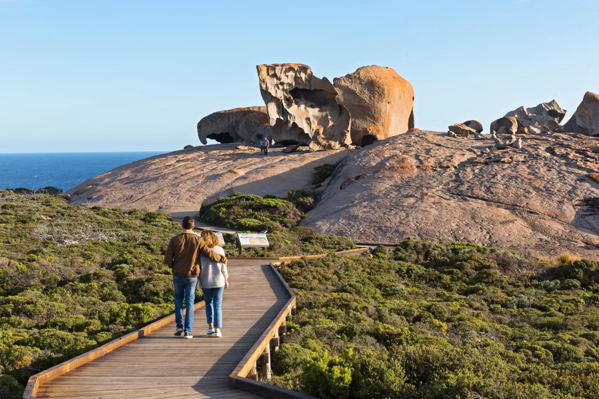 Couple walking along a boardwalk to the Remarkable Rocks